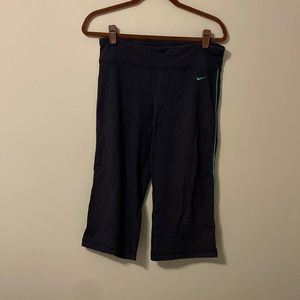 Womens Nike capri pants, Size M, green strip down the side